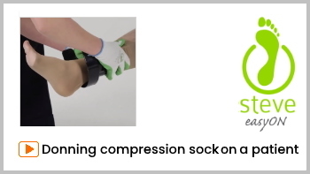 Putting on compression socks on someone else with donner Steve EasyON